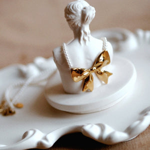 Pearl Bow Necklace In Silver