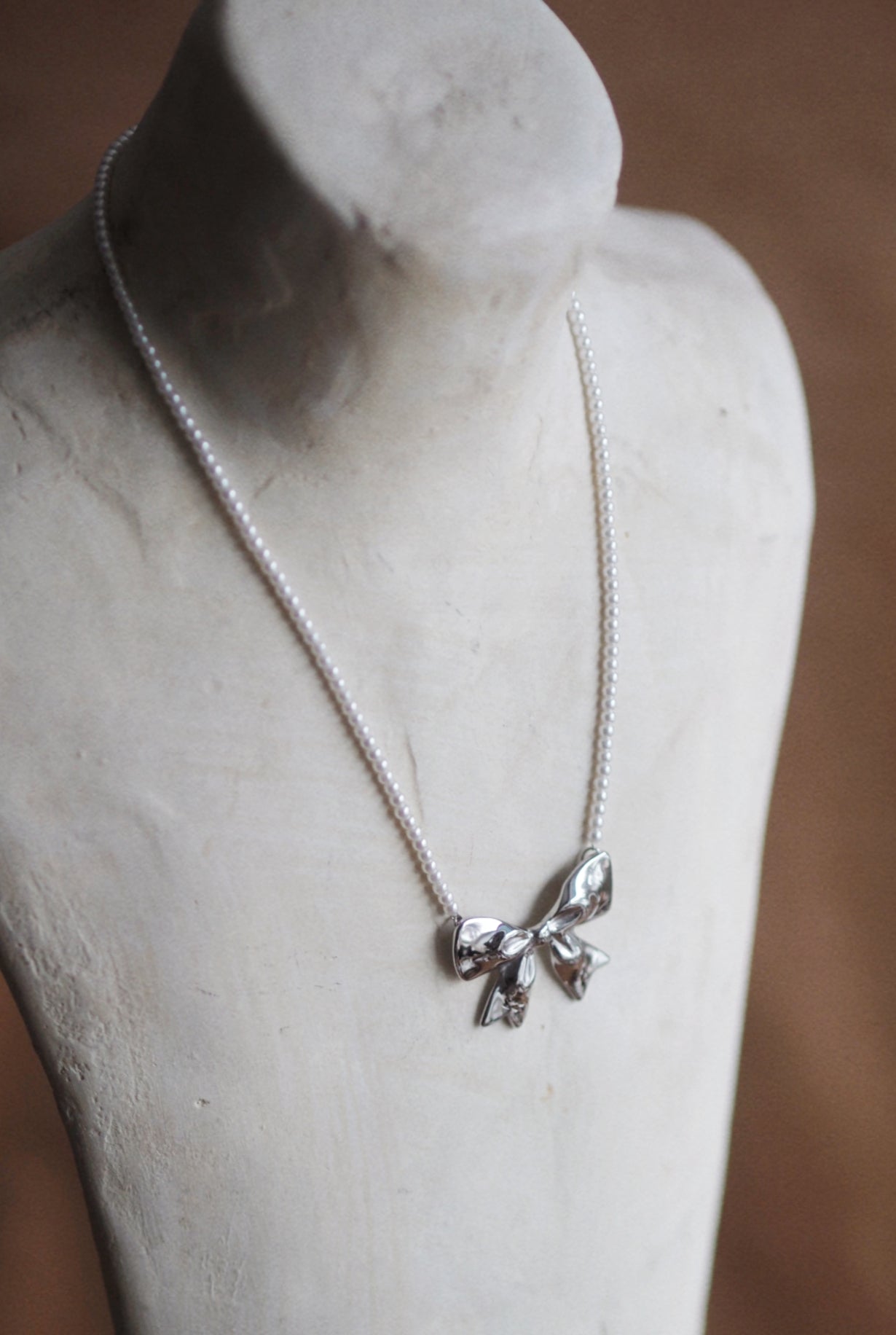Pearl Bow Necklace In Silver