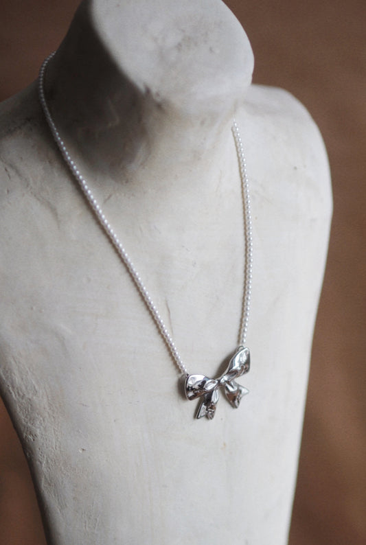 Pearl Bow Necklace In Silver