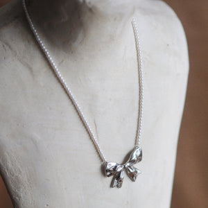 Pearl Bow Necklace In Silver